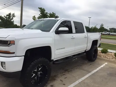 The same white Silverado clean and shiny after its wash